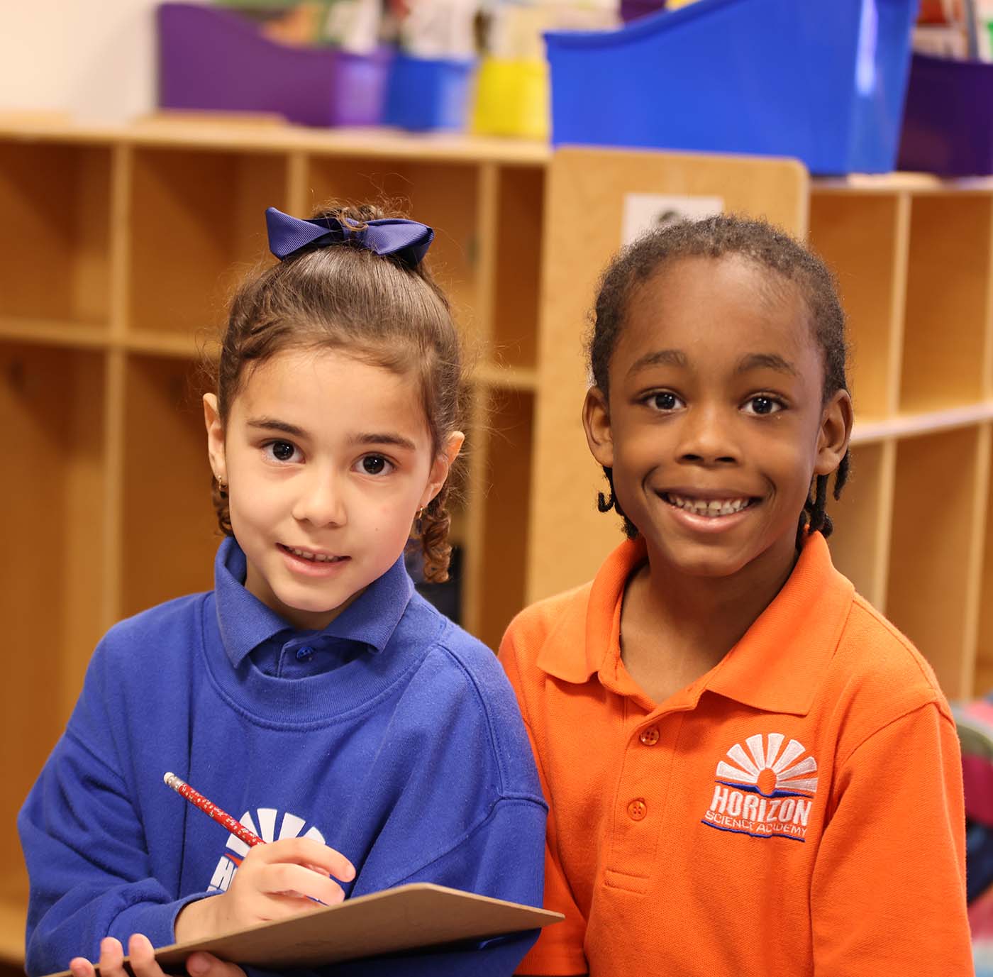 Horizon Science Academy of Lorain student drawing at a desk in a classroom setting