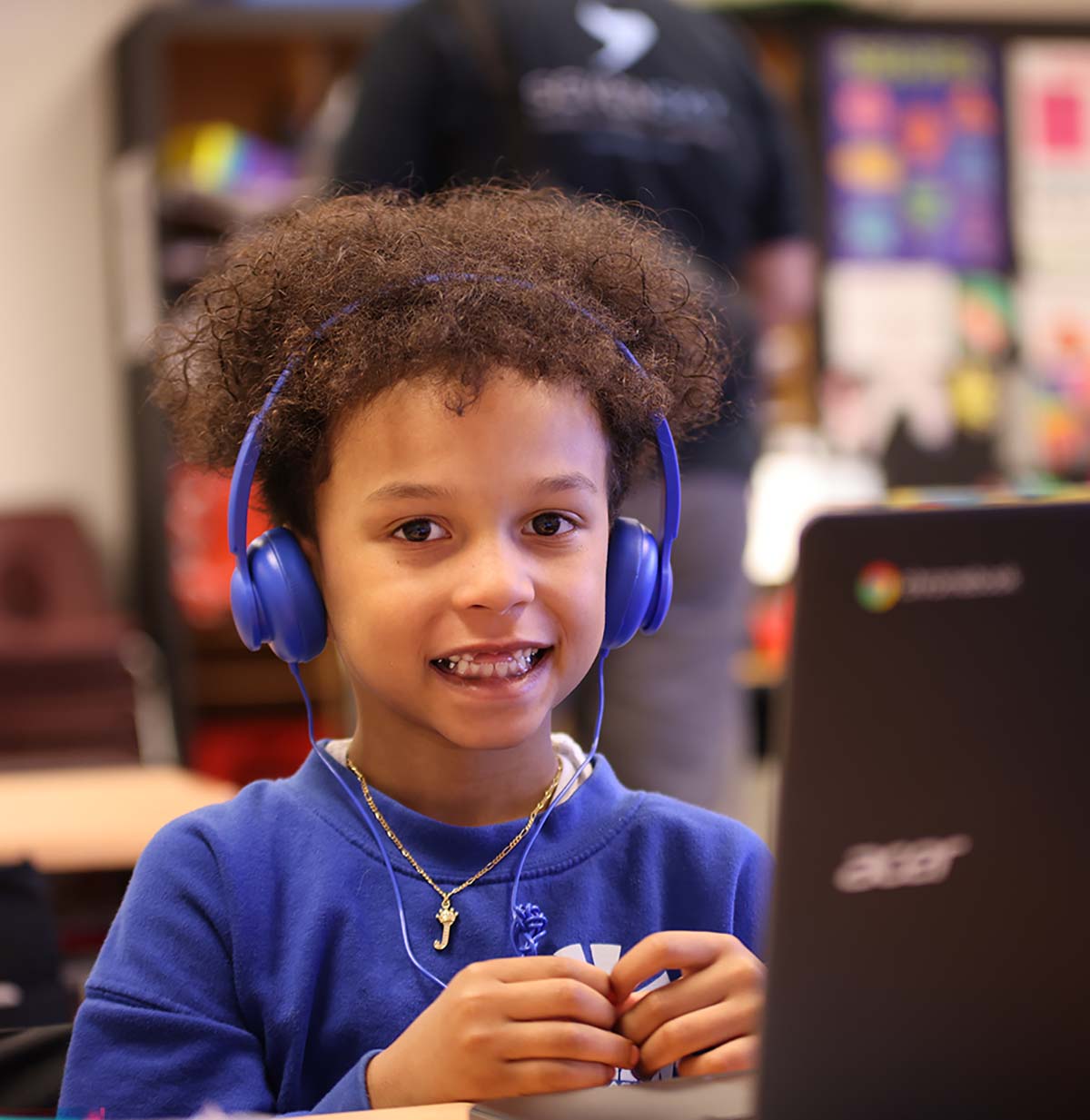 Student drawing in a classroom.